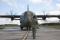 16 July 2010: Three engines running, one ready to start. A Royal Air Force loadmaster signals to the flight crew onboard the aircraft to start engine number one. The RAF sent two C-130Js to RAF Kinloss for the Combined Strength 2010 exercise. The RAF has two C-130J units, XXIV and 30 Squadrons, both based at RAF Lyneham.