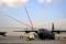 The United Arab Emirates Air Force display team, Al Fursan, performs an aerial demonstration behind a US Air Force C-130J Super Hercules during the Dubai Airshow at the Dubai World Central Airport in Jebel Ali, United Arab Emirates. The C-130J is assigned to Keesler AFB, Mississippi.