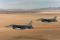 Two F-16C Fighting Falcon pilots from the 182nd Fighter Squadron in San Antonio, Texas, conduct low-level combat training during Coronet Cactus exercise near Davis-Monthan AFB, Arizona, in April 2014. The exercise provides realistic combat training for student fighter pilots from air-to-air combat to dropping inert and live ordnance.