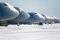 C-5M Super Galaxy aircraft sit on the flight line at Dover AFB, Delaware, after the base received six inches of snow in January 2014.